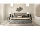 A main bedroom with a bed, lamps, and a wall decoration at 12245 E Clinton St, Scottsdale, AZ 85259