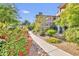 Scenic walkway lined with colorful flowers and plants, leading through the well-maintained community at 14000 N 94Th St # 3159, Scottsdale, AZ 85260