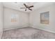 Empty bedroom with carpet flooring, neutral walls, and ceiling fan at 1401 N Houck St, Casa Grande, AZ 85122