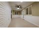 Cozy sun room featuring paneled walls, tiled floors, and natural light, perfect for relaxation at 15021 N 7Th Dr, Phoenix, AZ 85023