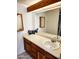 Bathroom vanity with modern sink, wood cabinets, and neutral countertops providing ample storage and style at 16402 N 31St St # 134, Phoenix, AZ 85032