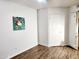 Bedroom showcasing wood flooring, white walls, and a ceiling fan at 16402 N 31St St # 134, Phoenix, AZ 85032