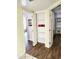 Hallway with a linen closet, wood flooring, and natural light at 16402 N 31St St # 134, Phoenix, AZ 85032