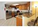 Kitchen with stainless steel appliances, wood cabinets, and granite countertops at 16402 N 31St St # 134, Phoenix, AZ 85032