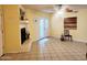 Spacious living room features a fireplace and neutral tile flooring, offering a versatile living space at 16402 N 31St St # 134, Phoenix, AZ 85032