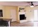 A cozy living room with a fireplace and a door to the outside at 16402 N 31St St # 134, Phoenix, AZ 85032