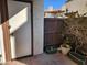 Outdoor patio showing plants in pots and wood fence to give the space privacy at 16402 N 31St St # 134, Phoenix, AZ 85032