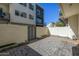 Paver-stone backyard, bordered by a sturdy block wall, offers a private and low-maintenance outdoor area at 1717 E Morten Ave # 16, Phoenix, AZ 85020