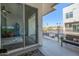 Relaxing balcony view features outdoor seating with sunny city views and sliding glass door access to the modern interior at 1717 E Morten Ave # 16, Phoenix, AZ 85020