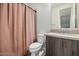 Bathroom featuring vanity with wood cabinets and a pink shower curtain at 1717 E Morten Ave # 16, Phoenix, AZ 85020