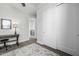Bedroom with a desk and a view to the entryway and en-suite bathroom at 1717 E Morten Ave # 16, Phoenix, AZ 85020