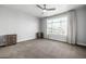 Bright bedroom featuring a ceiling fan, neutral walls, and a window with natural light at 1717 E Morten Ave # 16, Phoenix, AZ 85020