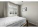 Bright bedroom features a large window and neutral decor at 1717 E Morten Ave # 16, Phoenix, AZ 85020