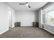 Spacious bedroom with a ceiling fan, neutral walls, and a window allowing ample natural light at 1717 E Morten Ave # 16, Phoenix, AZ 85020