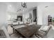 Open floorplan shows the dining room, kitchen, and staircase with neutral modern design at 1717 E Morten Ave # 16, Phoenix, AZ 85020