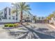 Modern condominium exterior featuring contemporary design, gated entrance, and beautiful landscaping at 1717 E Morten Ave # 16, Phoenix, AZ 85020