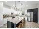 Spacious kitchen boasts a large center island, stainless appliances, and stylish pendant lights at 1717 E Morten Ave # 16, Phoenix, AZ 85020
