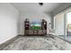 Bright living room featuring a flat-screen TV, modern decor, and a sliding glass door to the balcony at 1717 E Morten Ave # 16, Phoenix, AZ 85020