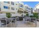 Outdoor patio with dining area, surrounded by lush greenery and modern architectural design at 1717 E Morten Ave # 16, Phoenix, AZ 85020