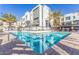 Community pool showcasing clear blue water, modern architecture, and lush landscaping for a relaxing oasis at 1717 E Morten Ave # 16, Phoenix, AZ 85020