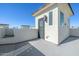Rooftop patio space with white stucco walls, offers an open-air setting for relaxation and entertainment at 1717 E Morten Ave # 16, Phoenix, AZ 85020