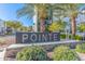 Attractive entrance signage with lush landscaping, showcasing the community's name and address at 1717 E Morten Ave # 16, Phoenix, AZ 85020