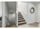 Well-lit staircase with carpeted steps and white railings, leading to the upper levels of the home at 1717 E Morten Ave # 16, Phoenix, AZ 85020