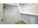 Walk in closet with shelves and racks at 17310 W Seldon Ln, Waddell, AZ 85355