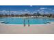 Resort-style community pool area with ample lounge seating at 17566 W Georgia Ave, Litchfield Park, AZ 85340