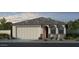 Charming single-Gathering home with a two-car garage and well-manicured landscaping at 17566 W Georgia Ave, Litchfield Park, AZ 85340