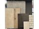 A flat lay sample of carpet, flooring, backsplash and paint colors for a home at 17566 W Georgia Ave, Litchfield Park, AZ 85340