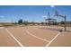 Community basketball court with nearby park, benches, and picnic tables at 17573 W Georgia Ave, Litchfield Park, AZ 85340