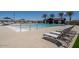 Community pool with lounge chairs and nearby changing rooms at 17573 W Georgia Ave, Litchfield Park, AZ 85340