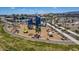 Aerial view of a community playground featuring slides, climbing structures, and shaded seating at 17605 W Georgia Ave, Litchfield Park, AZ 85340