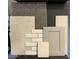 A curated selection of interior finish materials, including tile, carpet, and cabinet samples at 17605 W Georgia Ave, Litchfield Park, AZ 85340