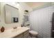Well-lit bathroom with a neutral color scheme and decorative accents at 18080 W Udall Dr, Surprise, AZ 85374