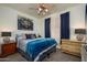 Cozy bedroom with ceiling fan and soft carpet at 18080 W Udall Dr, Surprise, AZ 85374