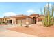 Lovely single-Gathering home with two-car garage, red tile roof, desert landscaping, and attractive paint at 18080 W Udall Dr, Surprise, AZ 85374