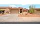 Single-Gathering home with two-car garage, desert landscaping, red tile roof, and desert landscaping at 18080 W Udall Dr, Surprise, AZ 85374