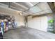 Spacious garage with large cabinets, storage racks and ample room for parking and projects at 18080 W Udall Dr, Surprise, AZ 85374