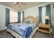 Serene main bedroom with a large window and soft lighting at 18080 W Udall Dr, Surprise, AZ 85374