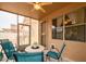 Cozy sunroom features comfortable seating and a view of the outdoor landscape, accessible to the backyard at 18080 W Udall Dr, Surprise, AZ 85374