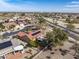 An aerial shot showcases the community with lush green spaces and mountain views at 18400 N Deer Grass Ct, Surprise, AZ 85374
