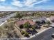 Aerial view of a desert community featuring terracotta tile roofs and desert landscaping at 18400 N Deer Grass Ct, Surprise, AZ 85374