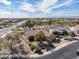 An aerial view of a suburban neighborhood with beautiful houses and lush desert landscaping at 18400 N Deer Grass Ct, Surprise, AZ 85374