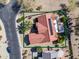 Aerial view of a home boasting a red tile roof, solar panels and well-kept landscaping at 18400 N Deer Grass Ct, Surprise, AZ 85374