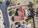 Overhead view of a house with terracotta tile roof, solar panels and a desert landscape at 18400 N Deer Grass Ct, Surprise, AZ 85374
