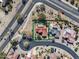 Stunning aerial view of a home featuring a red tile roof, solar panels and a private pool at 18400 N Deer Grass Ct, Surprise, AZ 85374