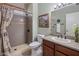 Cozy bathroom featuring a shower, sink with vanity, and tile flooring at 18400 N Deer Grass Ct, Surprise, AZ 85374