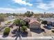 Beautiful desert home featuring a lush landscape, charming curb appeal and tile roof at 18400 N Deer Grass Ct, Surprise, AZ 85374